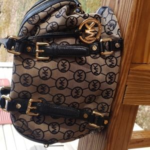 Michael Kors signature jacquard bowling bag style purse. Excellent condition.